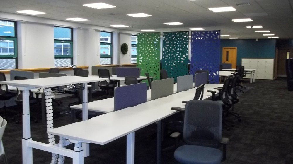 room_with_long_desks_and_chairs 